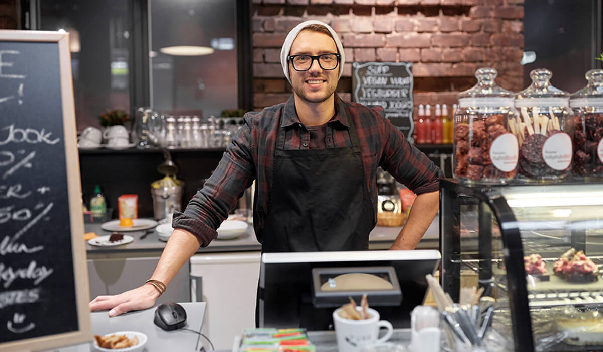 A happy Triniteq customers in his cafe using PowerEPOS