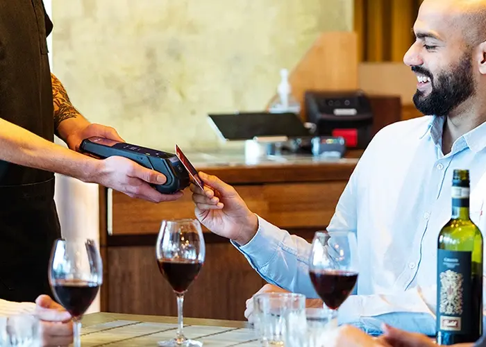 A customer paying their bill via Zero Payments