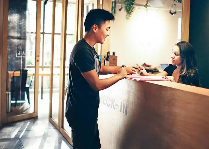 A customer checking in at a hotel