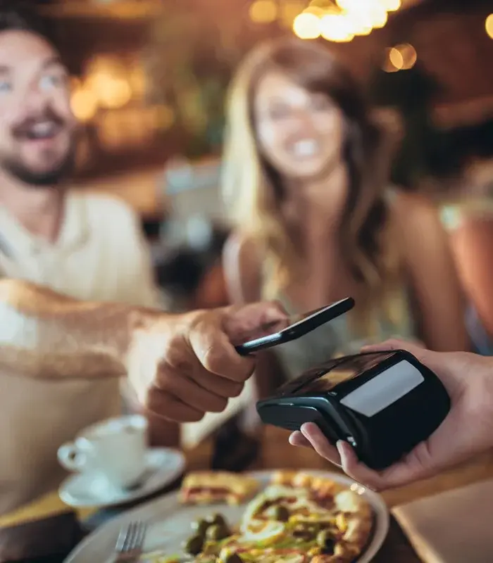 Customers paying their bill with their phone