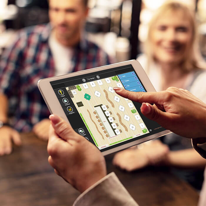 PowerEPOS on a tablet being used to take an order at a table.