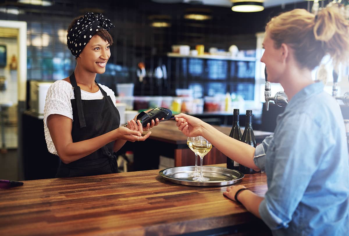 Staff accepting payments through terminal